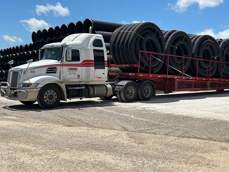 Timewell truck loaded with MaxFlex corrugated drainage tile.